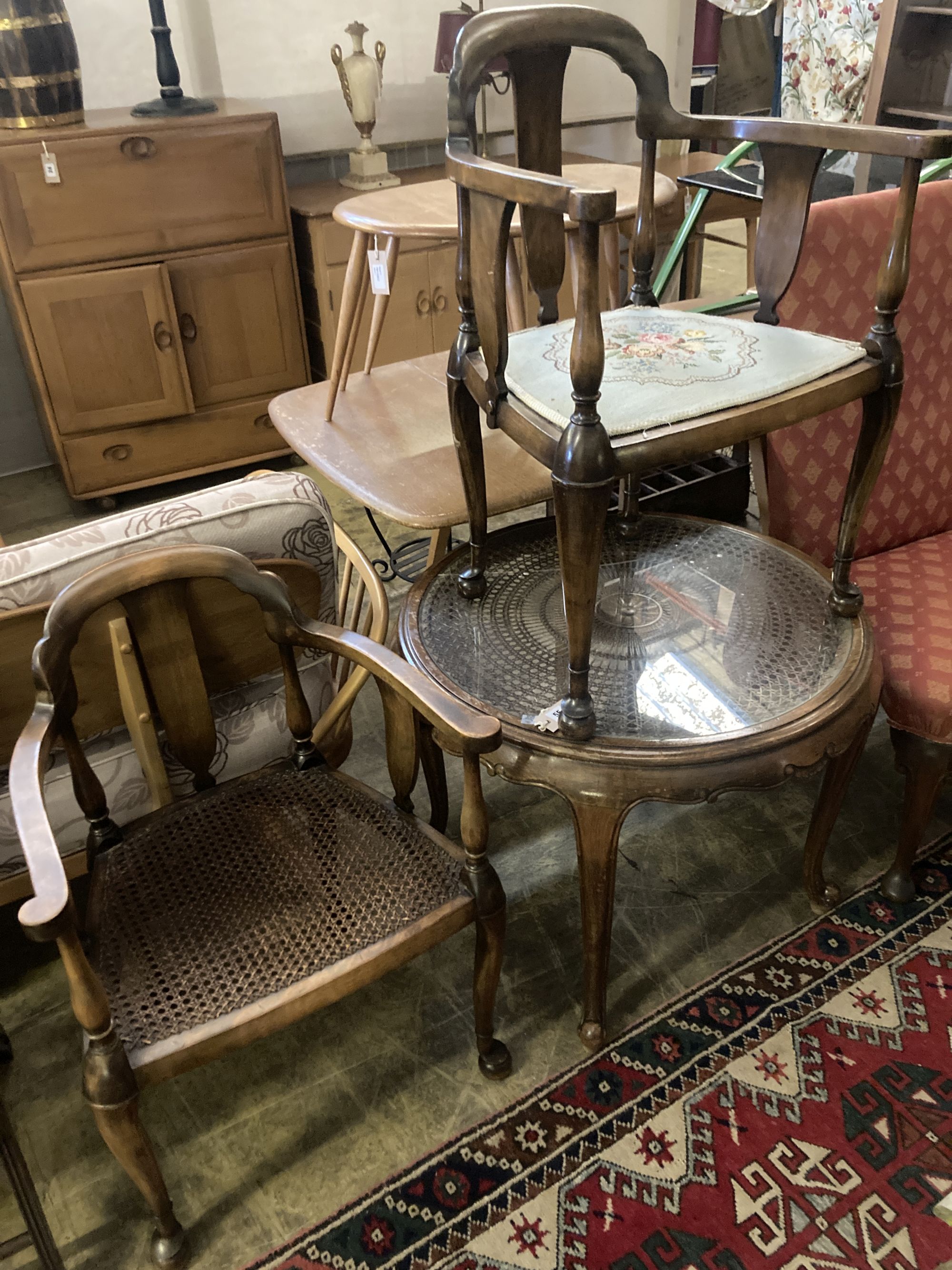 A 1920s circular caned beech occasional table, diameter 76cm, together with a pair of elbow chairs, one with a later tapestry seat